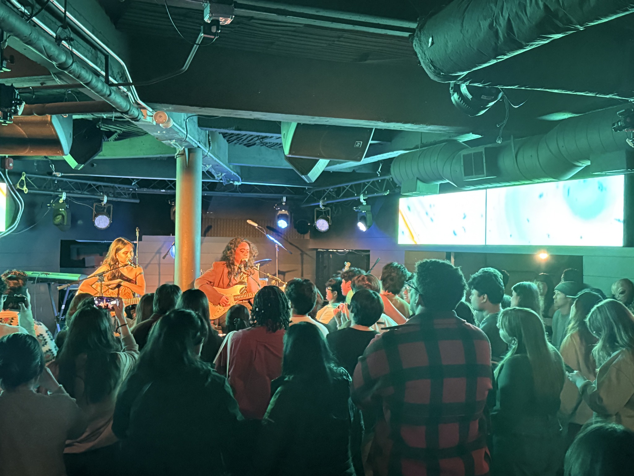 Audience watching a live performance at BOOKCLUB's intimate Chicago music venue